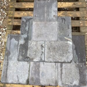 A display of Welsh roof slates showing purple colours.