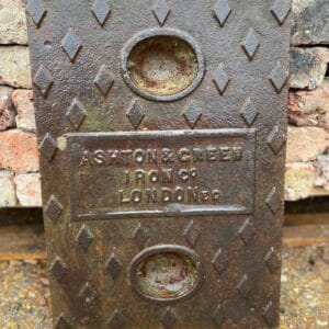 A small cast iron manhole cover.