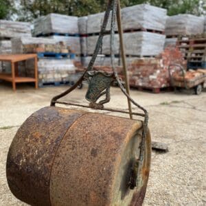 An antique cast iron garden roller.