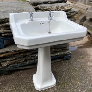 A reclaimed Burlington chisel edge sink with pedestal
