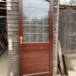 An external door with an overlay leaded glazed panel.