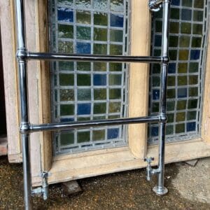 A reclaimed chrome heated towel rail.