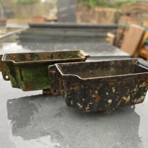 Two matching reclaimed cast iron hoppers.