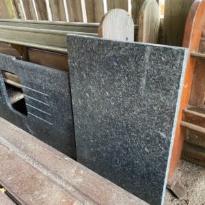 A reclaimed granite worktop in two parts to set into a corner.