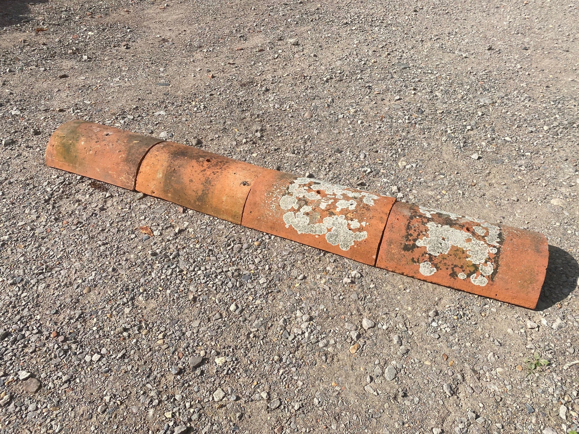 Terracotta Third Round Hips - Best Reclamation A Display Of Reclaimed Third Round Hips Showing Lichen Growth And Patina.