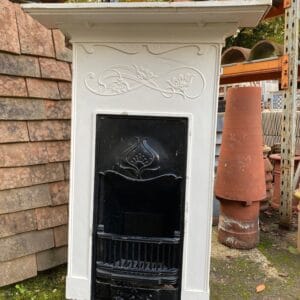 An original Art Nouveau combination fireplace in unrestored condition.