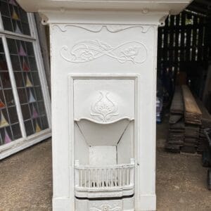 An original Art Nouveau combination fireplace in unrestored condition.