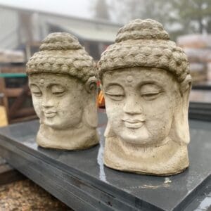 Two Matching Buddha Head Busts Made From Reconstituted Stone.
